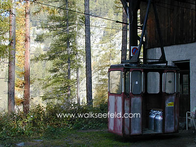 A cable car being used to transport milk churns in the South Tyrol